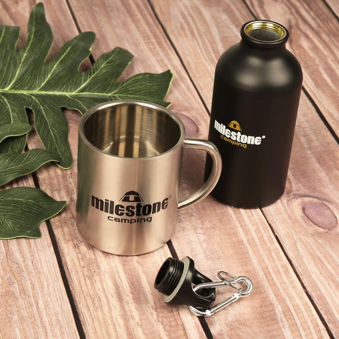 Milestone Stainless Steel Mug on slatted wooden floor with bottle